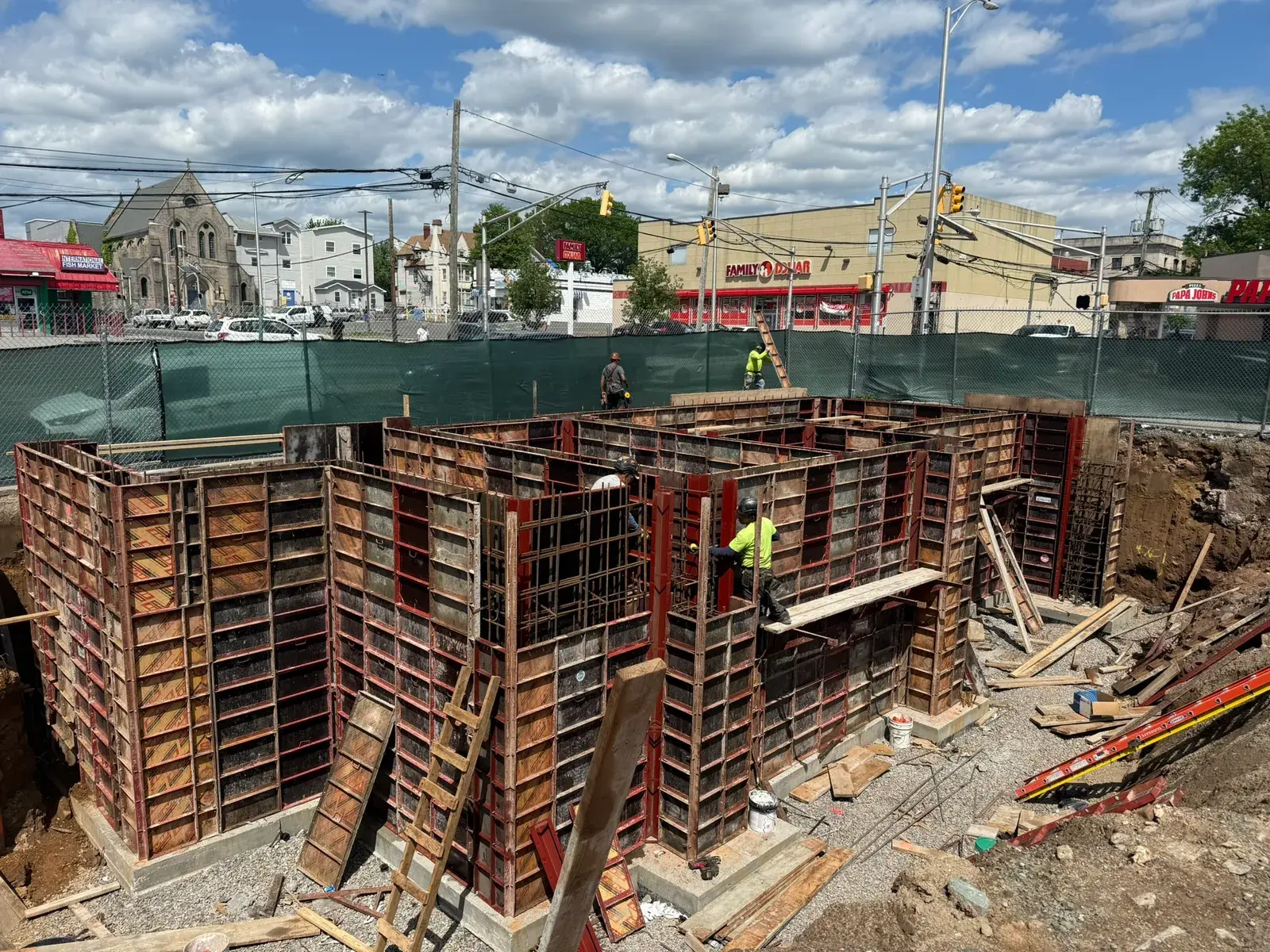 Rachid Construction Group crew setting concrete foundation forms